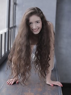 Curly brunette posing